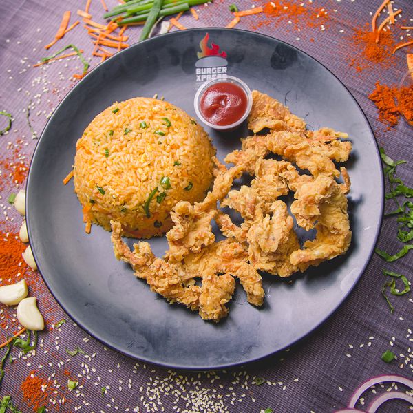 Crispy, juicy fried chicken served on a bed of tender rice.